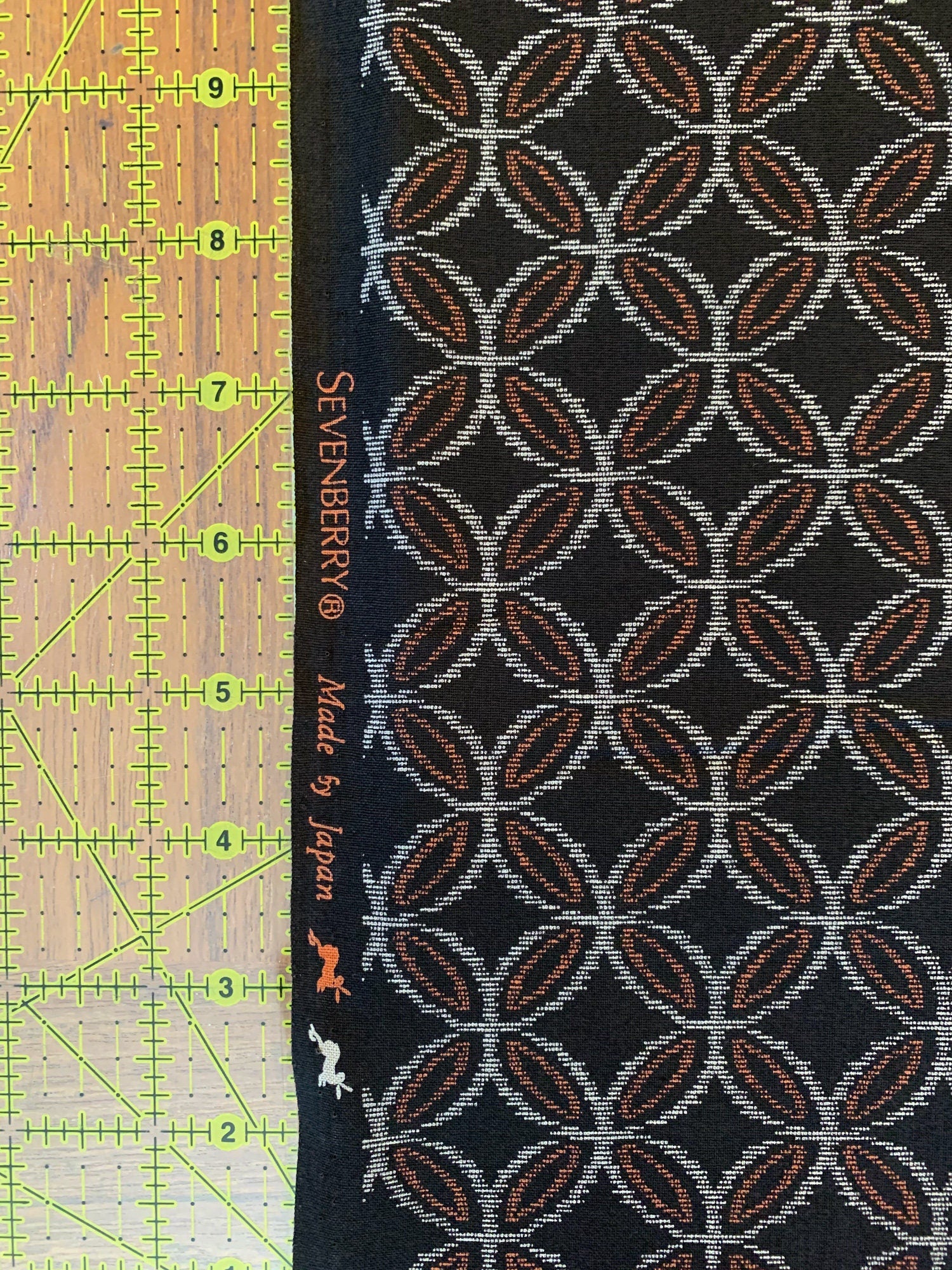 Sevenberry printed Ikat kasuri shippou circles Japanese cotton fabric 88229-2-3 black orange