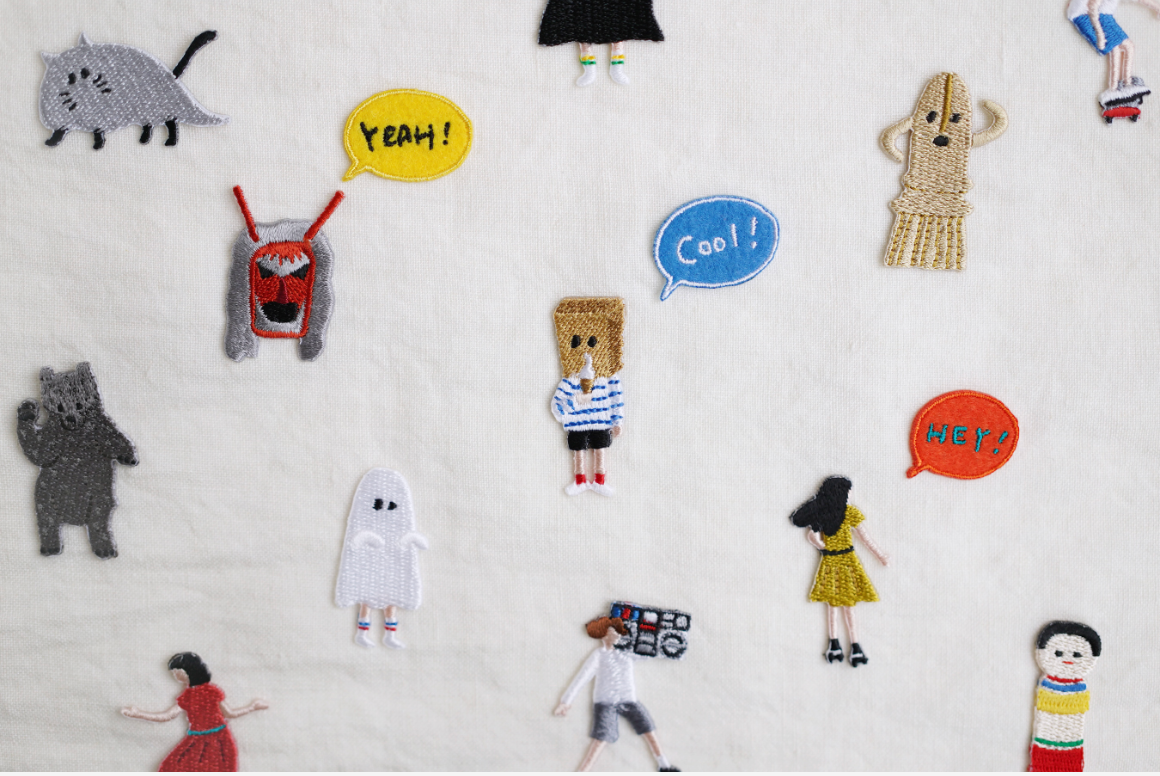 Embroidered stickers with people, animals, ghosts, and text designs