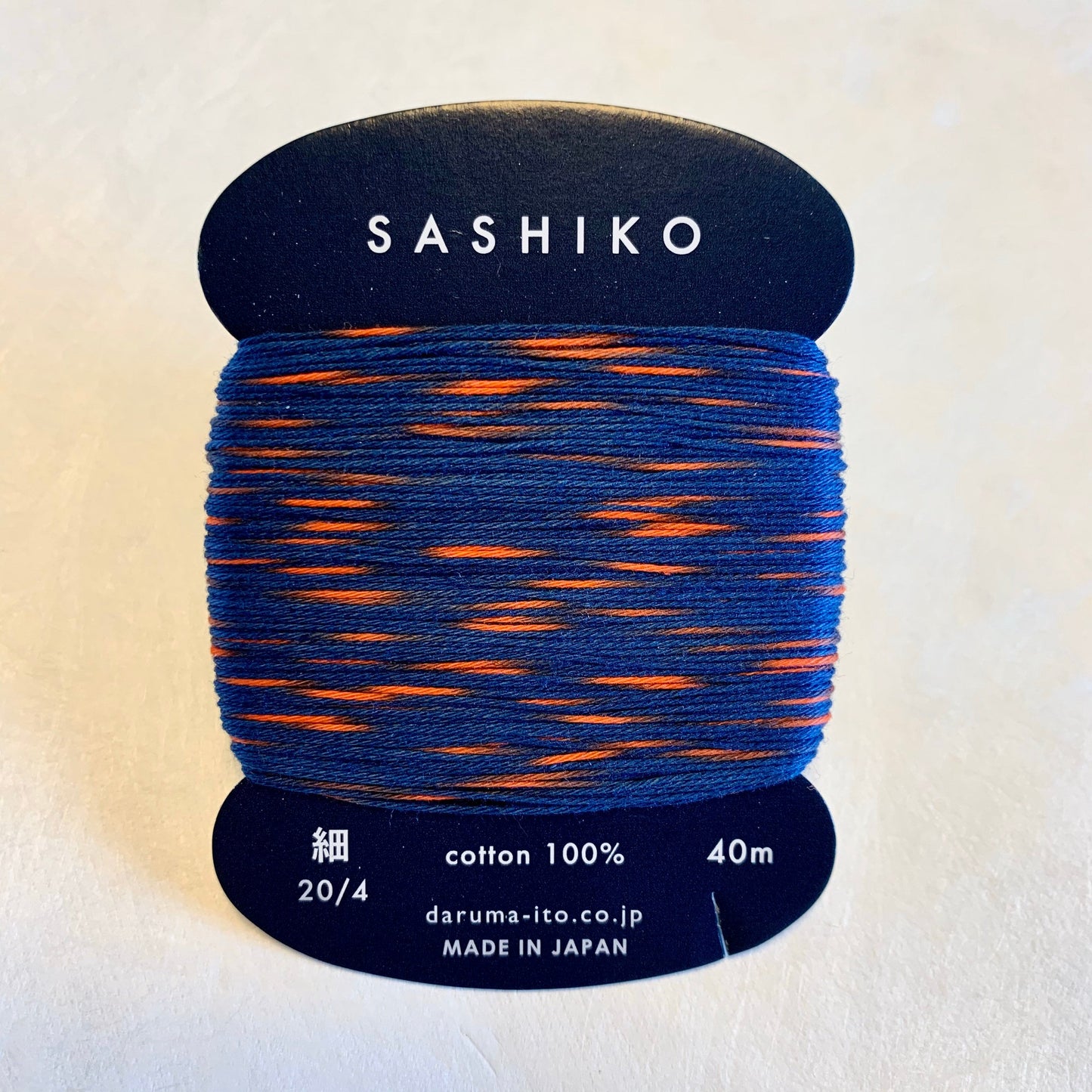 Daruma #302 "SPARKLER" variegated navy blue and flame red Japanese Cotton SASHIKO thread 40 meter skein 20/4