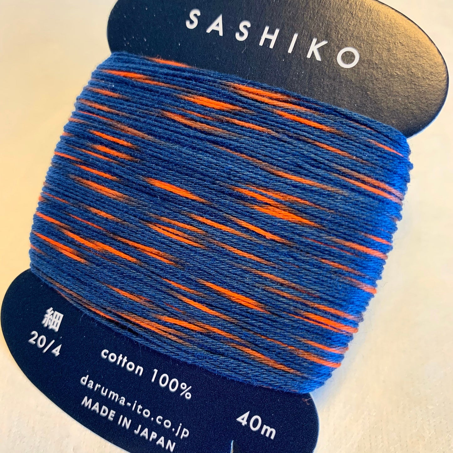 Daruma #302 "SPARKLER" variegated navy blue and flame red Japanese Cotton SASHIKO thread 40 meter skein 20/4