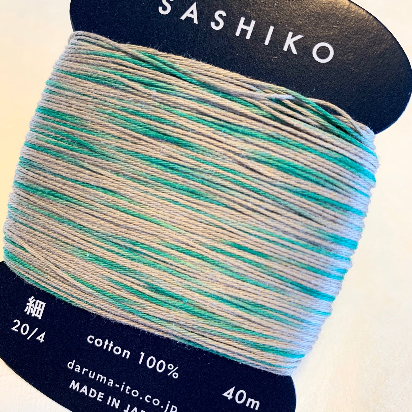 Daruma #301 "RAIN SOUNDS" variegated gray and green Japanese Cotton SASHIKO thread 40 meter skein 20/4