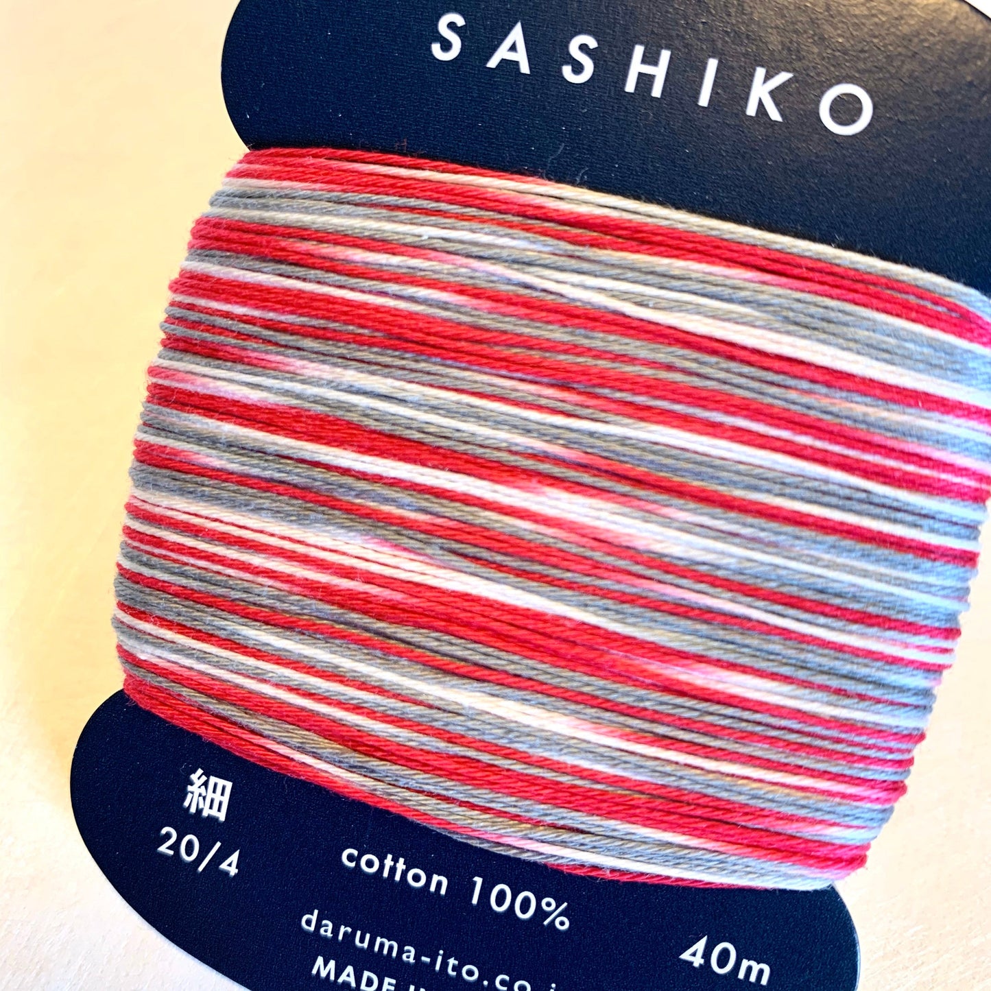 Daruma #403 MORNING GLORY variegated red white and gray Japanese Cotton SASHIKO thread 40 meter skein 20/4