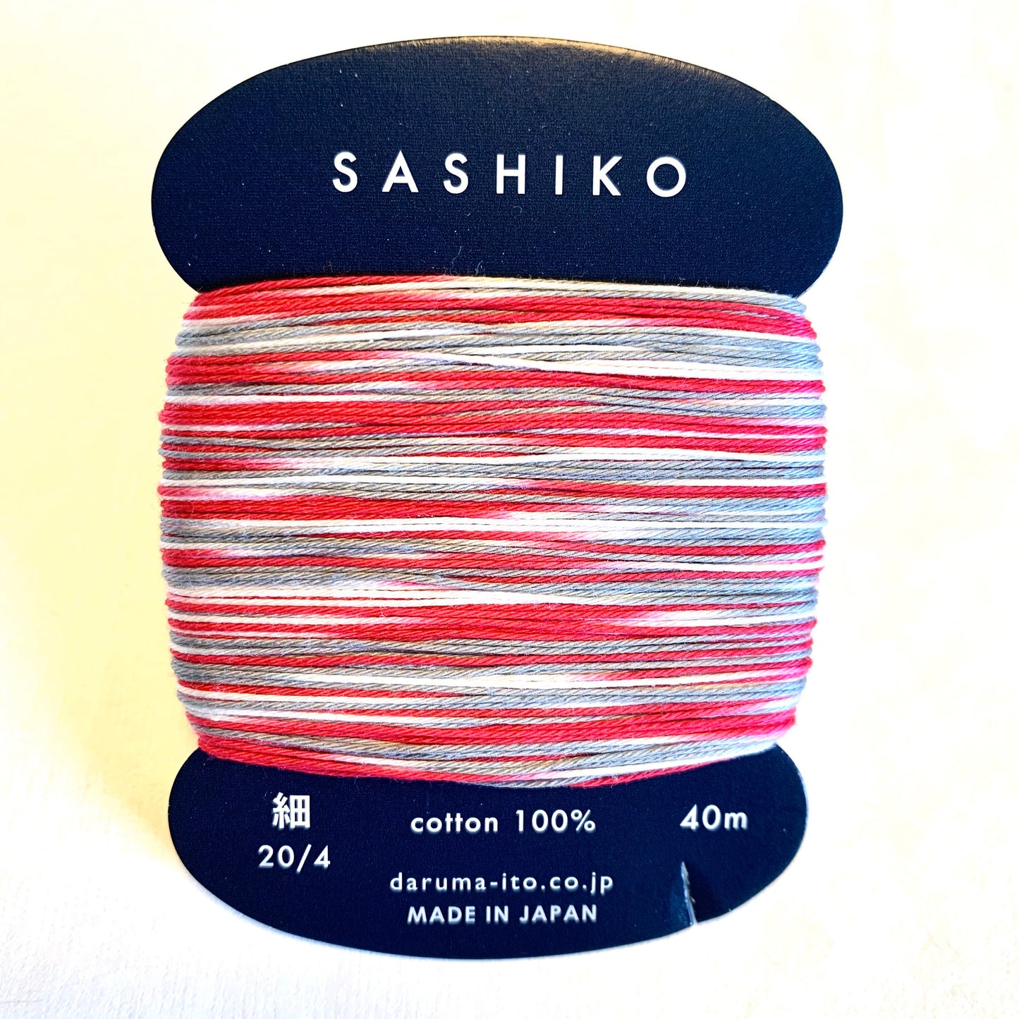 Daruma #403 MORNING GLORY variegated red white and gray Japanese Cotton SASHIKO thread 40 meter skein 20/4