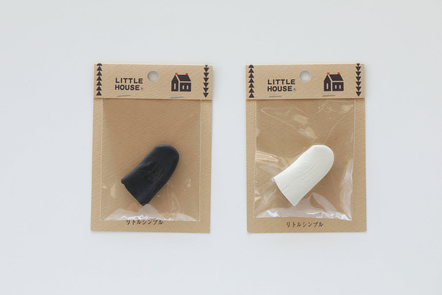Little House leather fingertip sewing thimbles in black or white
